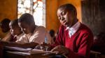 Suzana, 9, in her classroom in Tanzania.